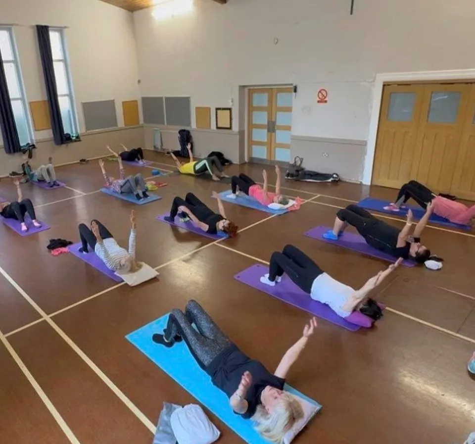Mat pilates exercise demonstrating spinal alignment